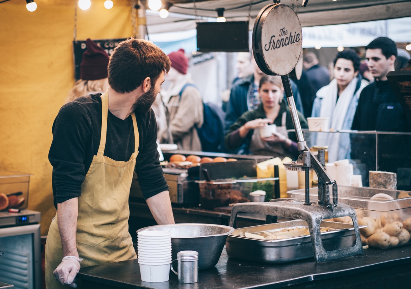 Image of customers at a market stall
