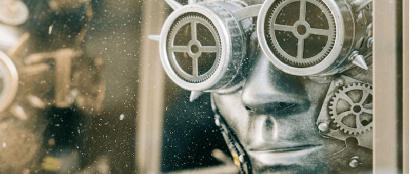 Grainy artistic image of a statue wearing mechanical glasses